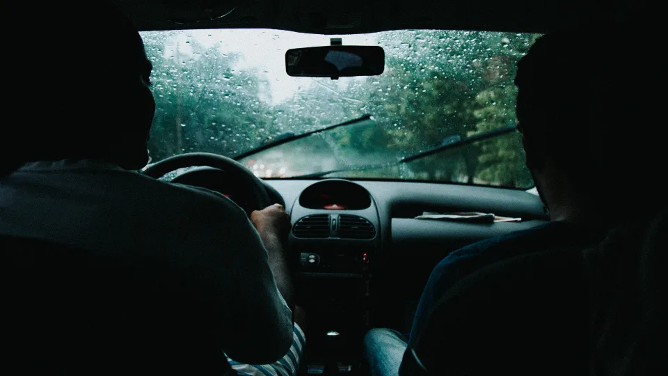 View from the driver seat on a rainy road