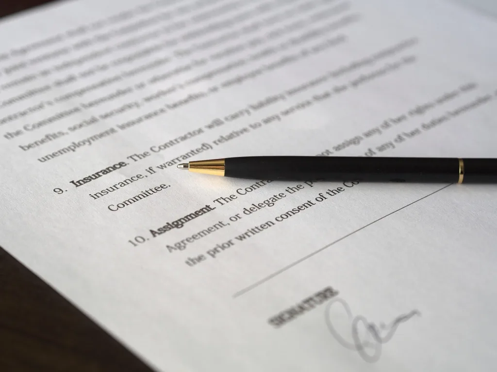 Pen resting on the signature line of an affidavit