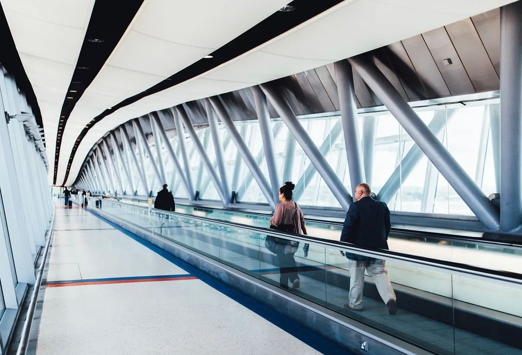 Passengers on an airport terminal walkway