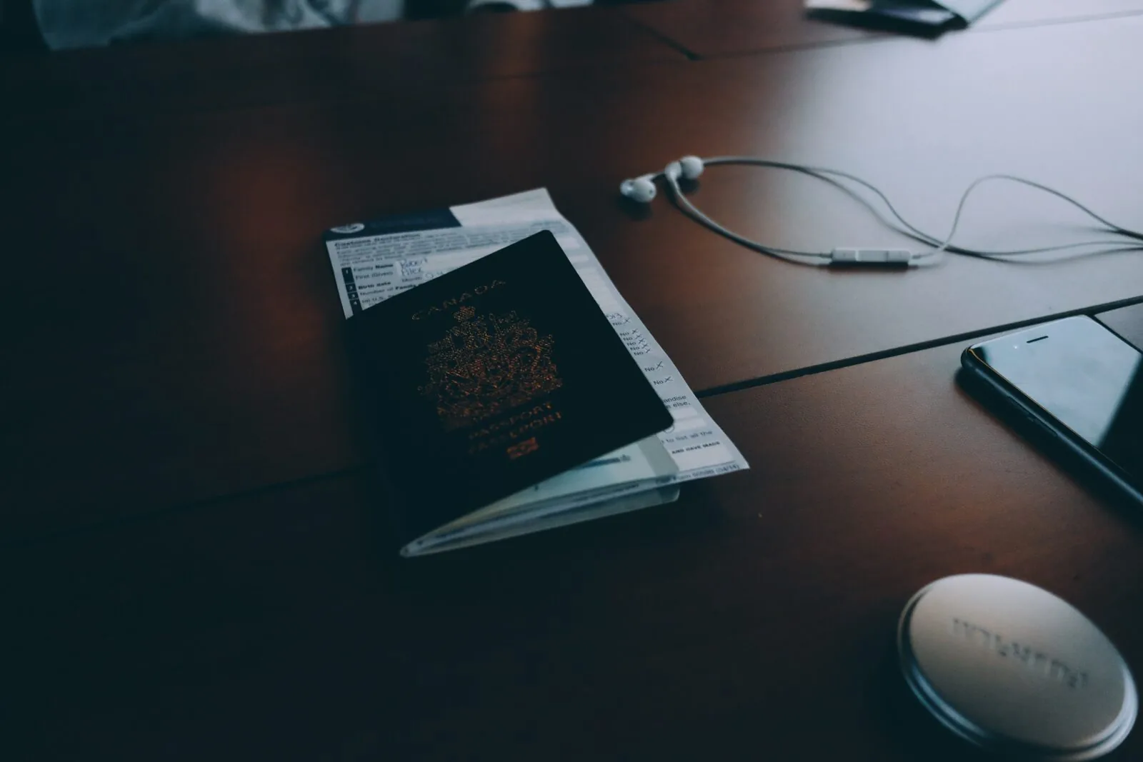 Passport resting on a completed application form on a desk